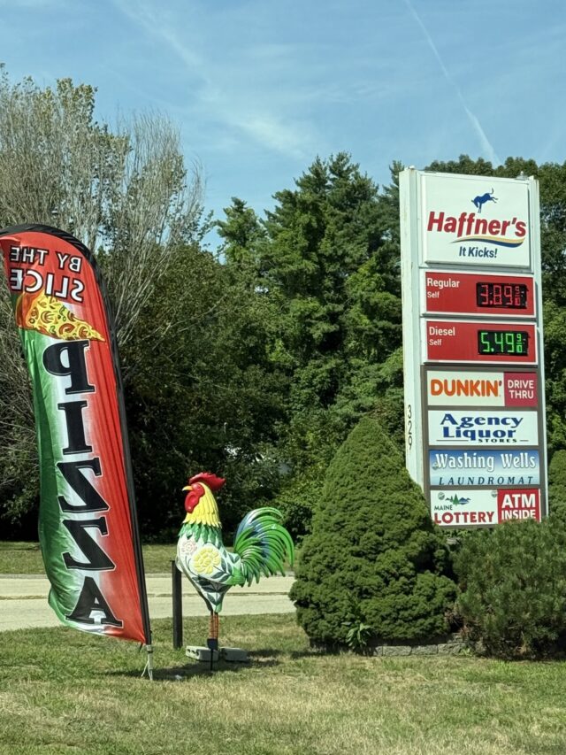 Rainbow-painted rooster statue near Haffner's gas station in Wells, Maine